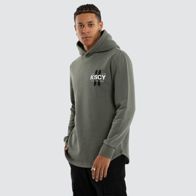 Model wears Inferno Dual Curved Hoodie Pigment Basil Hoodies Green – image 5