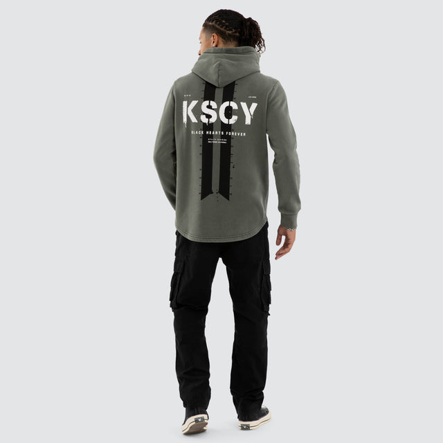 Model wears Inferno Dual Curved Hoodie Pigment Basil Hoodies Green – image 4