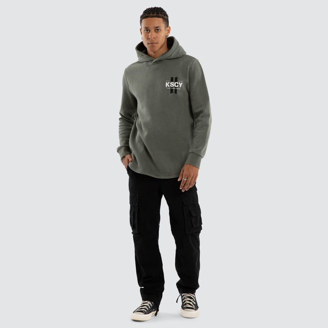 Model wears Inferno Dual Curved Hoodie Pigment Basil Hoodies Green – image 2
