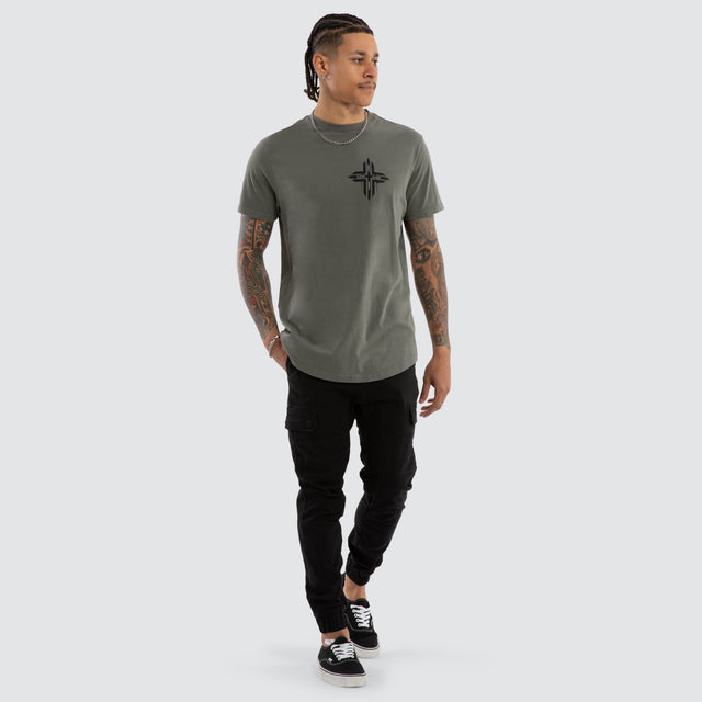 Model wears Preservation Dual Curved Tee Pigment Mulled Basil T-Shirts Green – image 2