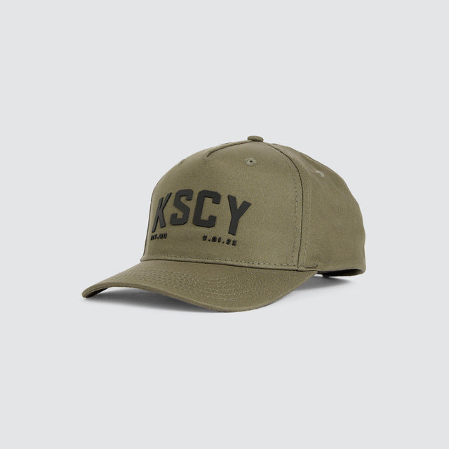 Model wears Cube Cap Khaki Caps Green – image 1