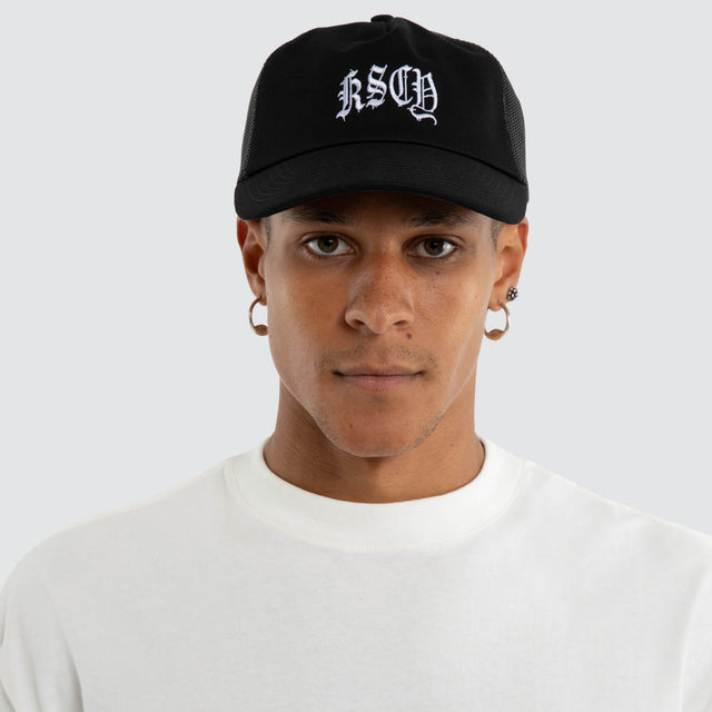 Model wears Scope Trucker Cap Jet Black Caps Black – image 2
