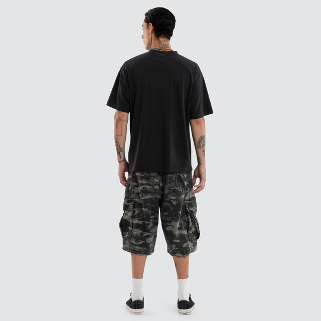 Model wears Torque Street Tee Pigment Anthracite T-Shirts Black – image 2