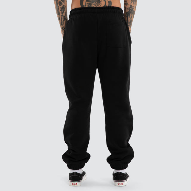 Model wears Earn Straight Trackpant Jet Black Trackpants Black – image 3