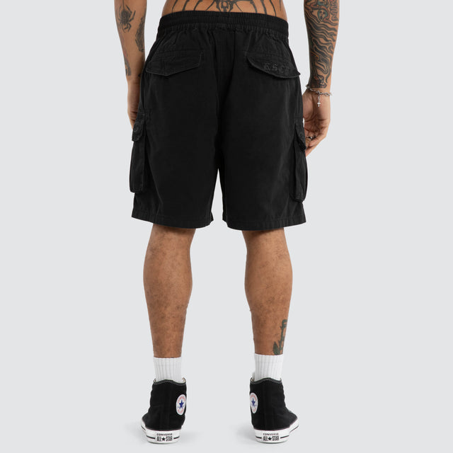 Model wears Mosh Baggy Cargo Short 2.0 Jet Black Shorts Black – image 3