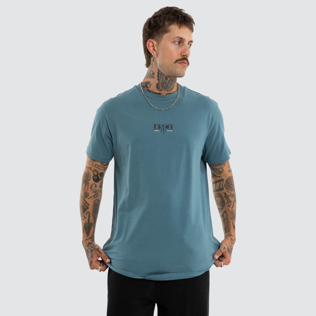 Model wears Dream Dual Curved Tee Aegean Blue T-Shirts Blue – image 1