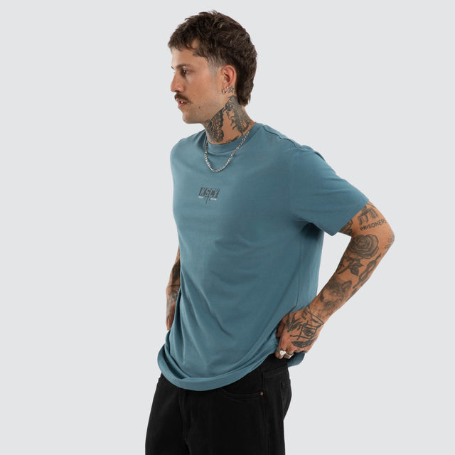 Model wears Dream Dual Curved Tee Aegean Blue T-Shirts Blue – image 3