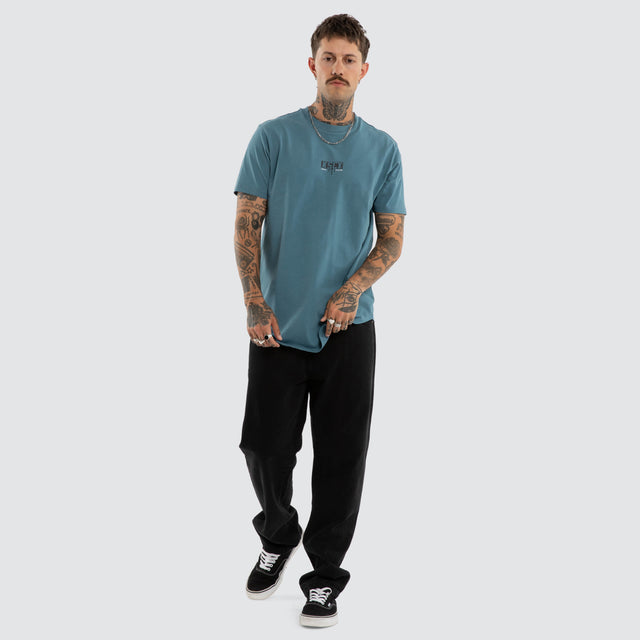 Model wears Dream Dual Curved Tee Aegean Blue T-Shirts Blue – image 5