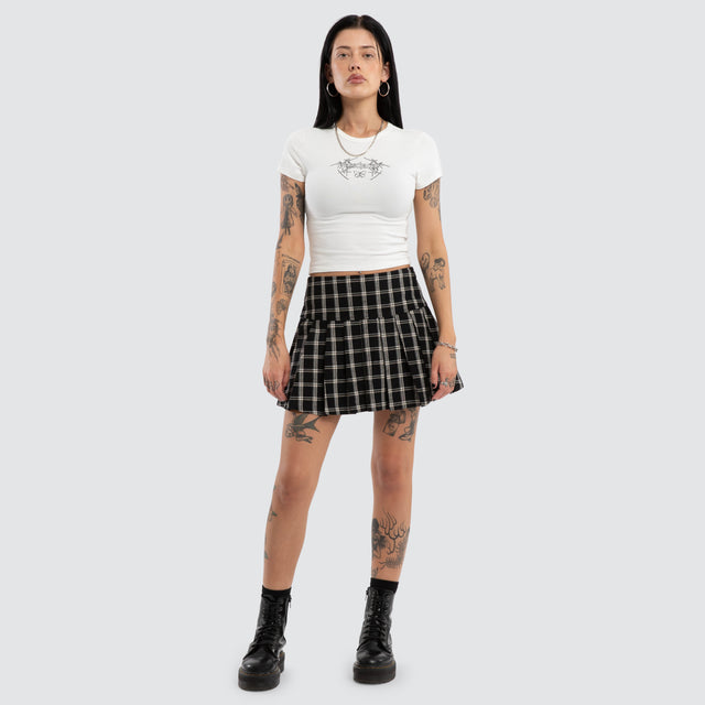 Model wears Tempest Pleated Skirt Black/White Check Skirt Black – image 4