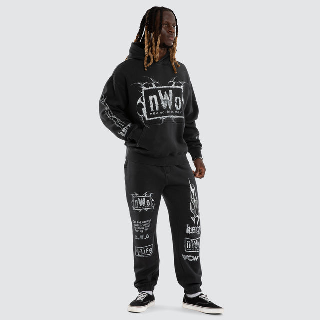 Model wears NWO 4 Life Straight Trackpant Pigment Anthracite Black Trackpants Black – image 5