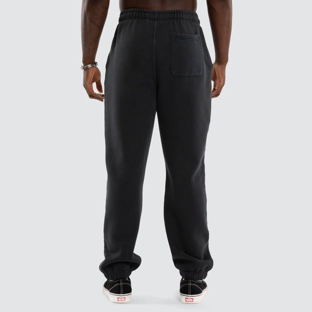 Model wears NWO 4 Life Straight Trackpant Pigment Anthracite Black Trackpants Black – image 3