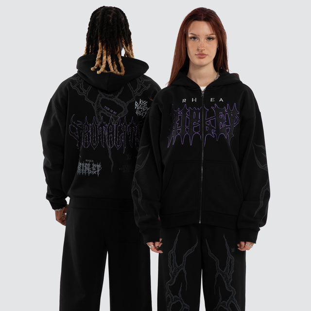 Model wears Rhea Ripley Chaos Street Zip Hoodie Anthracite Black Hoodies Black – image 1