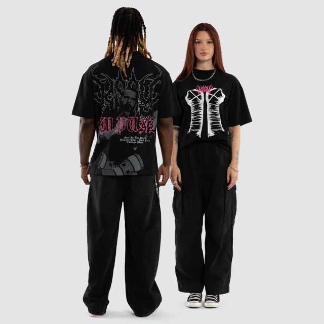 Model wears CM Punk Pipe Bomb Street Tee Jet Black T-Shirts Black – image 5