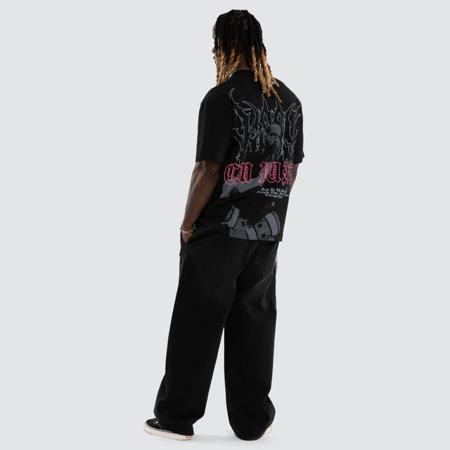 Model wears CM Punk Pipe Bomb Street Tee Jet Black T-Shirts Black – image 7