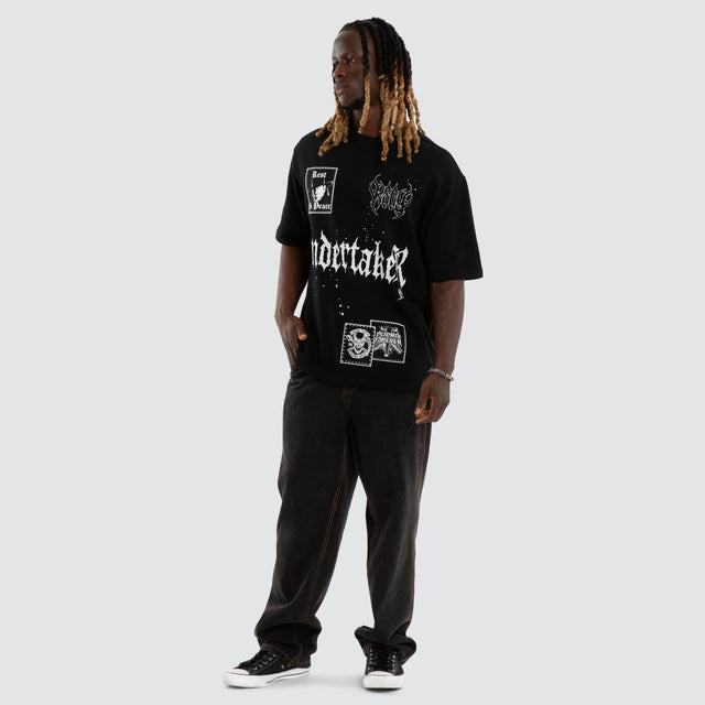Model wears The Undertaker Casket Oversized Tee Jet Black T-Shirts Black – image 2