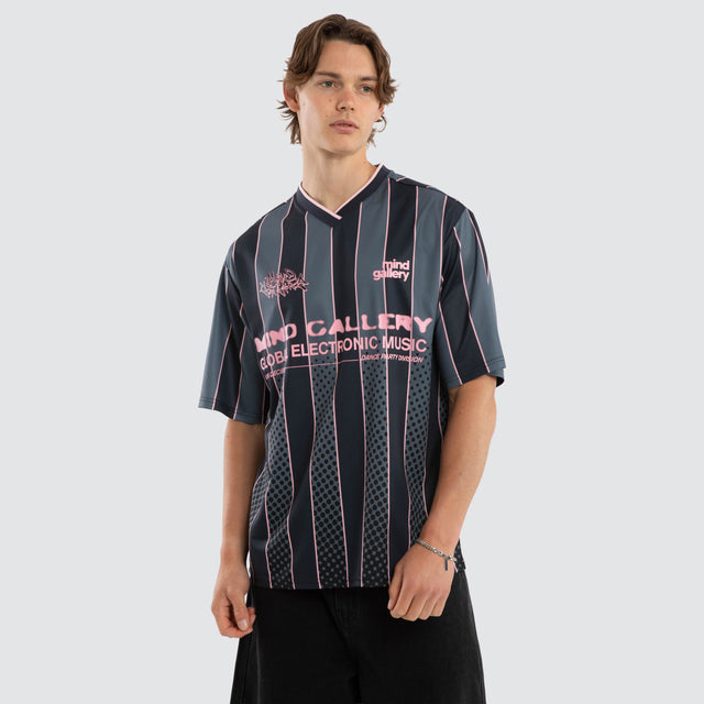 Model wears Metro Strike Football Jersey Black Stripe Jerseys Black – image 1