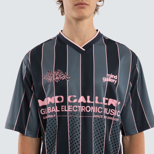 Model wears Metro Strike Football Jersey Black Stripe Jerseys Black – image 4