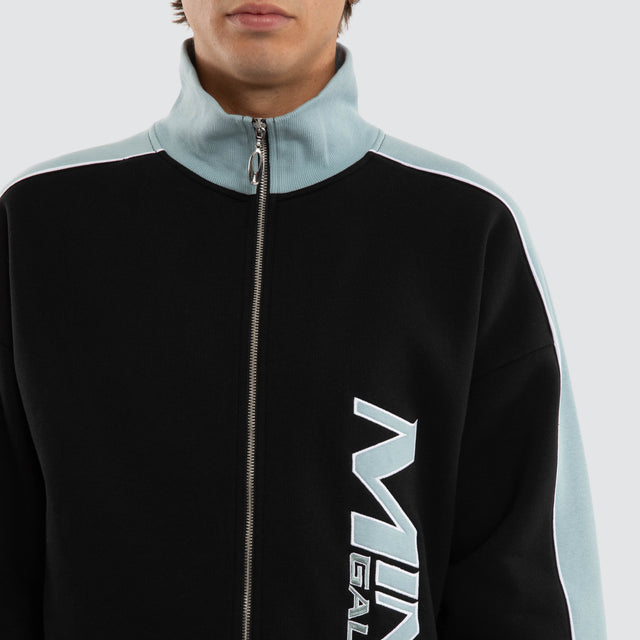 Model wears Audeo Track Zip Jacket Jet Black/Arona Teal Jackets Blue – image 4