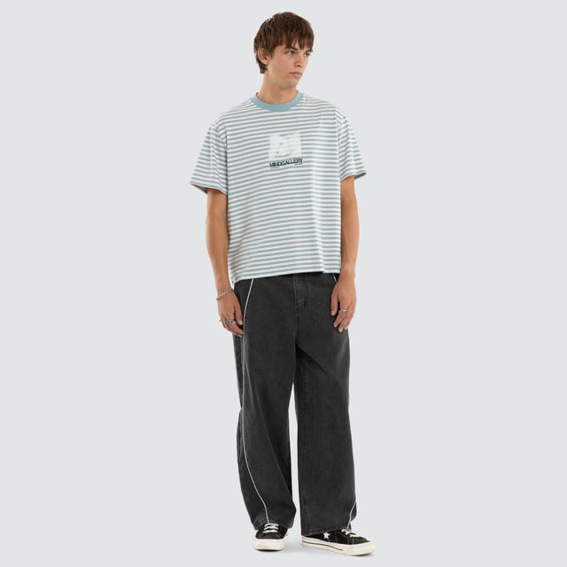 Model wears Manor Rocker Tee Nat White/ Arona Teal Stripe T-Shirts Blue – image 2