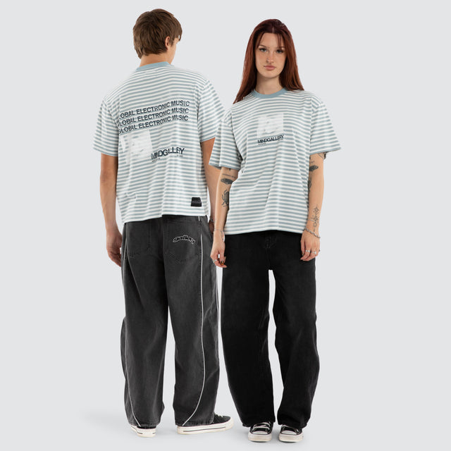 Model wears Manor Rocker Tee Nat White/ Arona Teal Stripe T-Shirts Blue – image 5