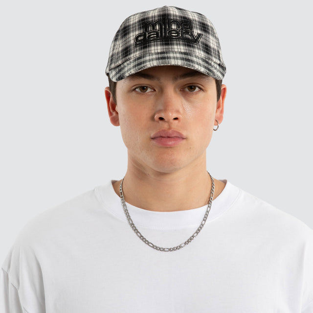 Model wears Dunne Cap Black Check Mind Gallery Black – image 2