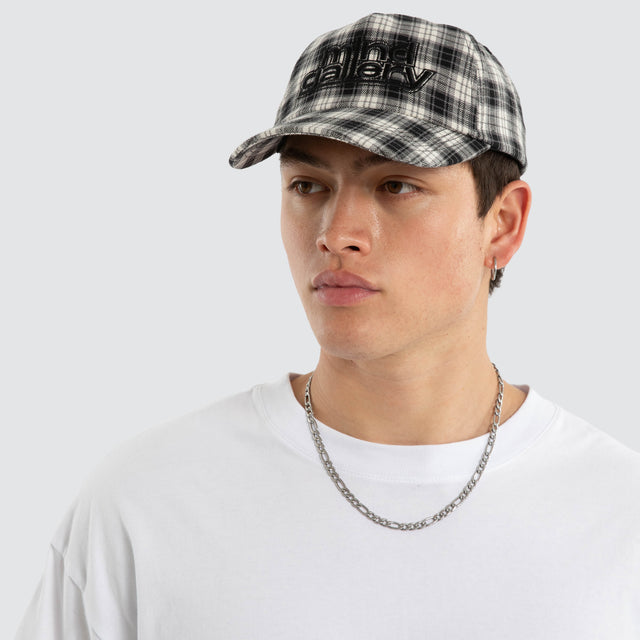 Model wears Dunne Cap Black Check Mind Gallery Black – image 5