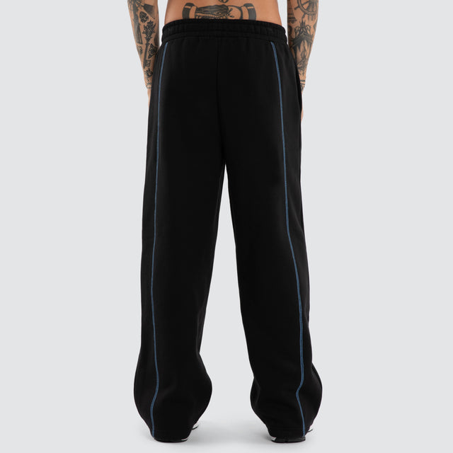 Model wears Stitch Tracksuit Pants Jet Black Trackpants Black – image 2
