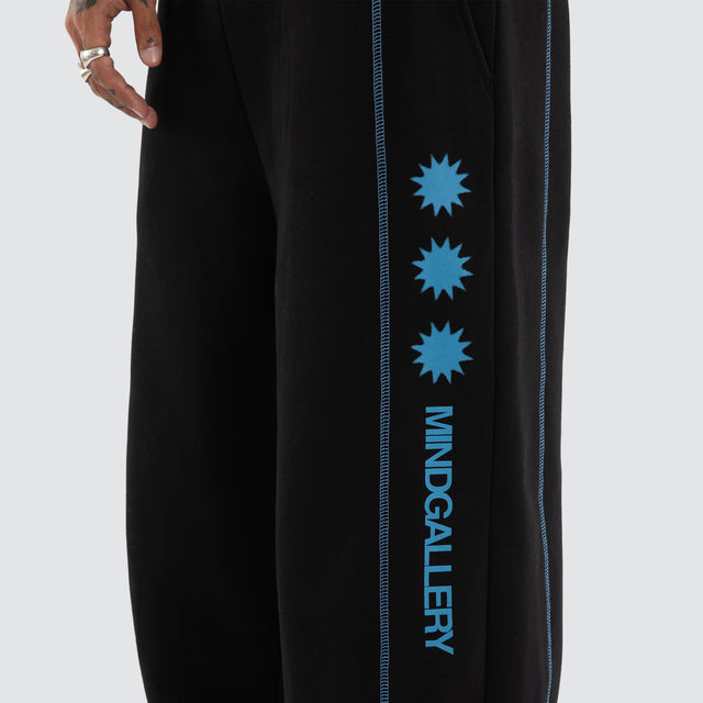 Model wears Stitch Tracksuit Pants Jet Black Trackpants Black – image 5