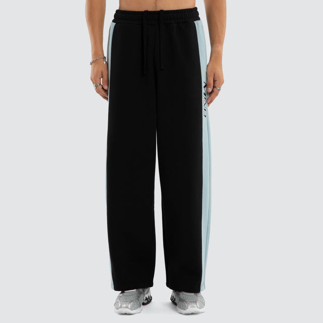 Model wears Grey Cloud Trackpants Jet Black/Arona Teal Trackpants Blue – image 5