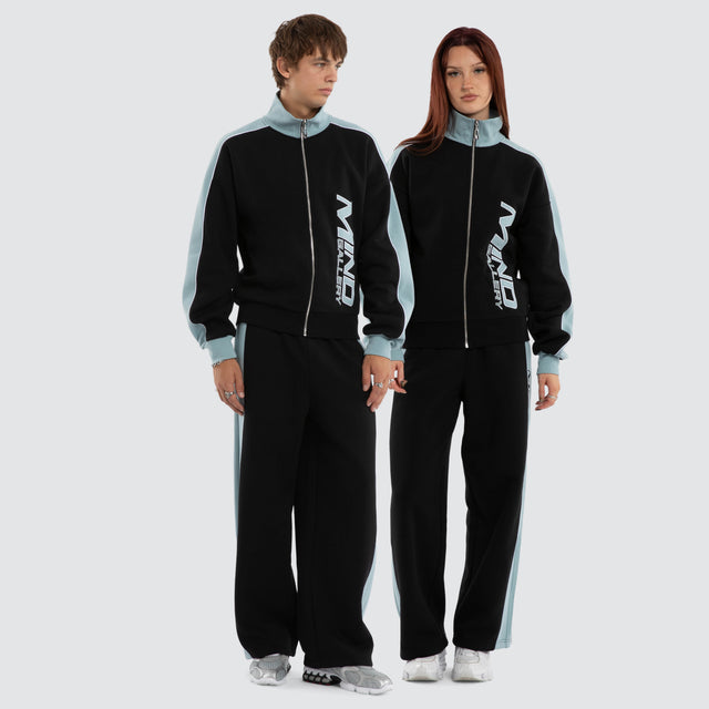 Model wears Grey Cloud Trackpants Jet Black/Arona Teal Trackpants Blue – image 1