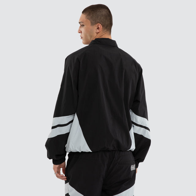 Model wears Las Vegas Raiders NFL Racing Jacket Jet Black/Silver Jackets Black – image 3