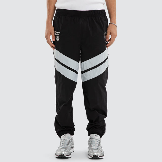 Model wears Las Vegas Raiders NFL Racing Pant Jet Black/Silver Pants Black – image 3