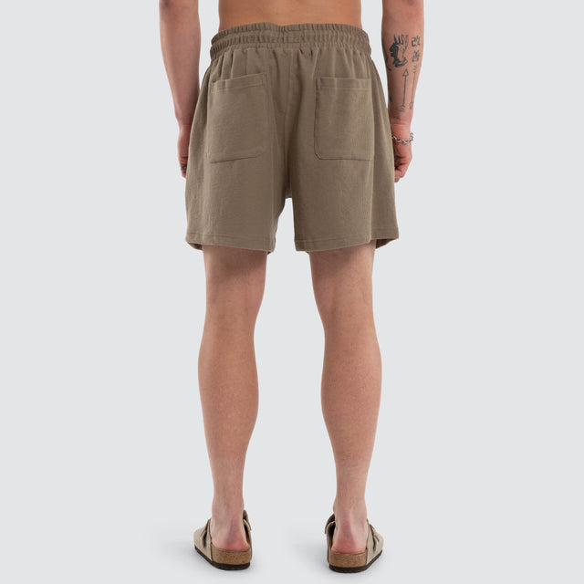 Model wears Matteo 6 Inch Daily Short Olive Shorts Green – image 2