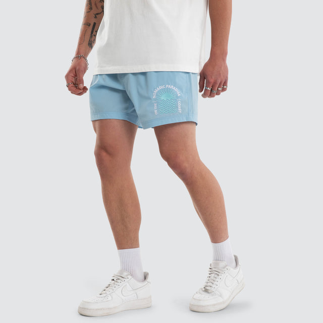 Model wears Coral 6 Inch Swim Short Baby Blue Shorts Blue – image 1