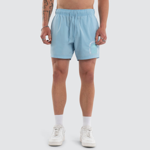 Model wears Coral 6 Inch Swim Short Baby Blue Shorts Blue – image 3