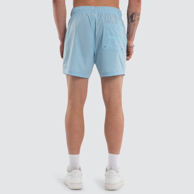 Model wears Coral 6 Inch Swim Short Baby Blue Shorts Blue – image 2
