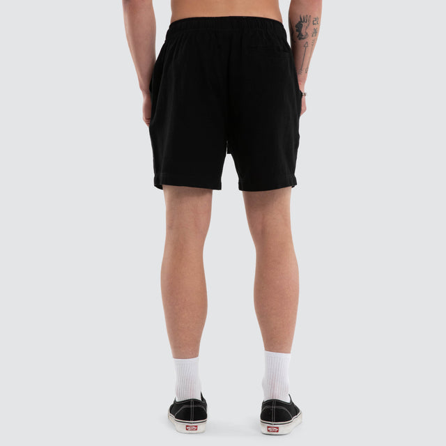 Model wears Coastal Linen Short Black Shorts Black – image 2