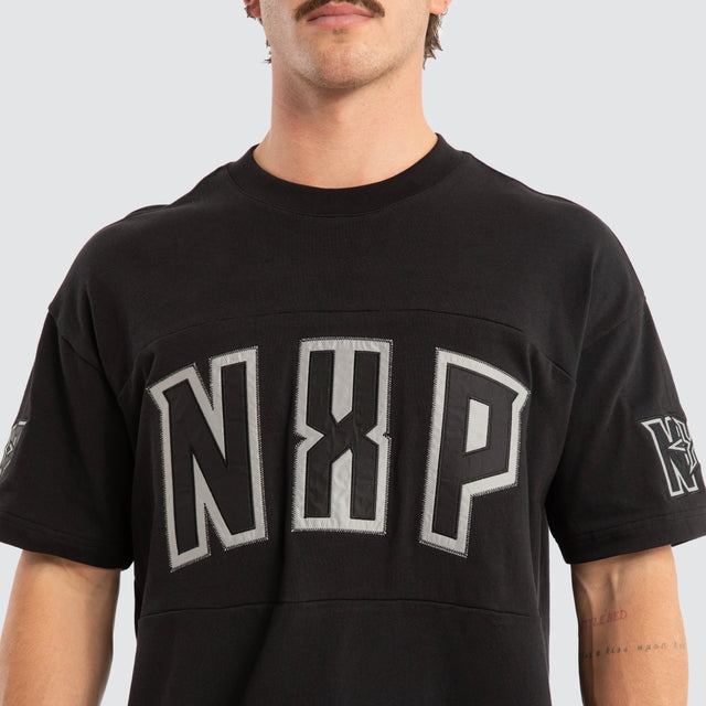 Model wears Beatdown Raptor Tee Jet Black T-Shirts Black – image 4