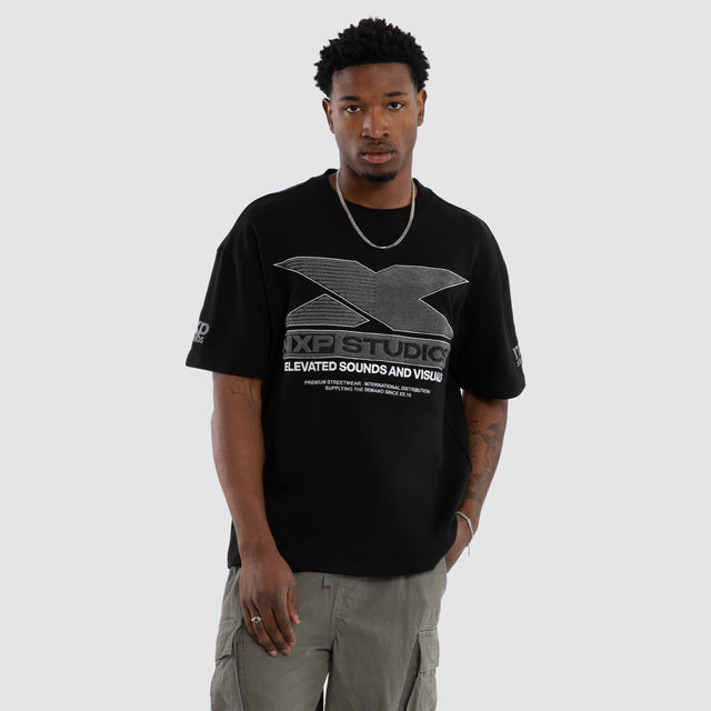 Model wears Exile Loopback Raptor Tee Jet Black T-Shirts Black – image 1