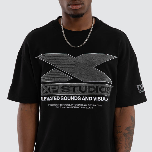 Model wears Exile Loopback Raptor Tee Jet Black T-Shirts Black – image 3