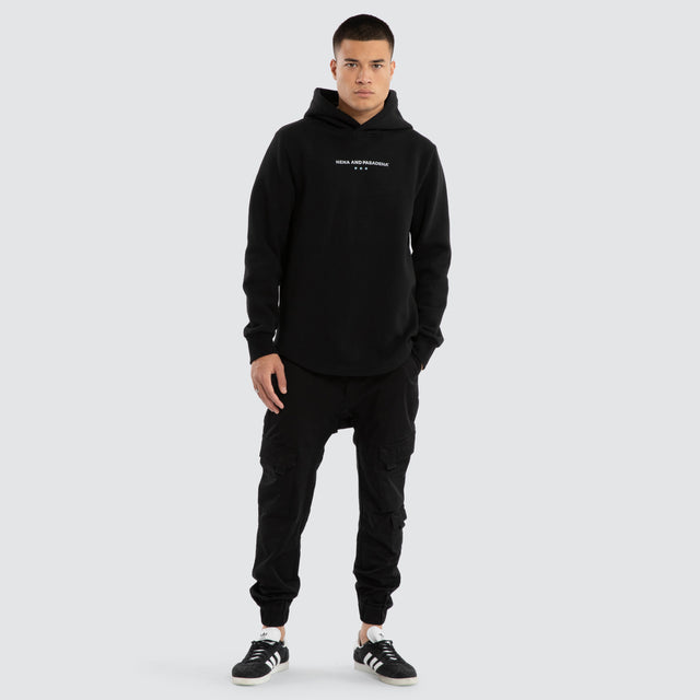 Model wears Unleash Dual Curved Hoodie Jet Black Hoodies Black – image 5