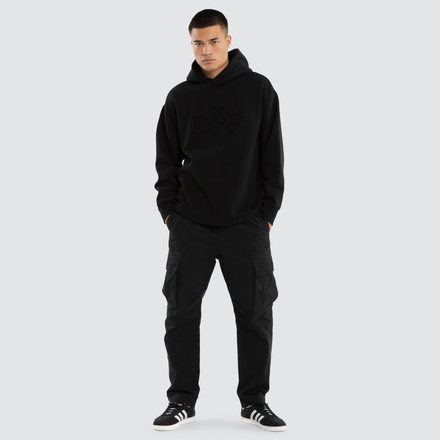 Model wears Supreme Relaxed Curved Hoodie Jet Black Hoodies Black – image 5
