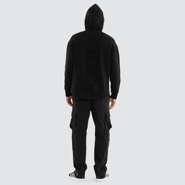 Model wears Supreme Relaxed Curved Hoodie Jet Black Hoodies Black – image 2