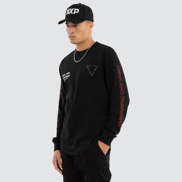 Model wears Unite Dual Curved Long Sleeve Tee Jet Black Longsleeve T-Shirts Black – image 3