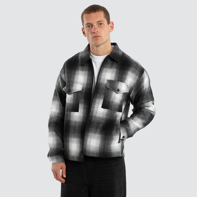 Model wears Rise Relaxed Jacket Black/White Check Jackets Black – image 1