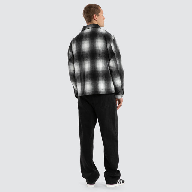 Model wears Rise Relaxed Jacket Black/White Check Jackets Black – image 2