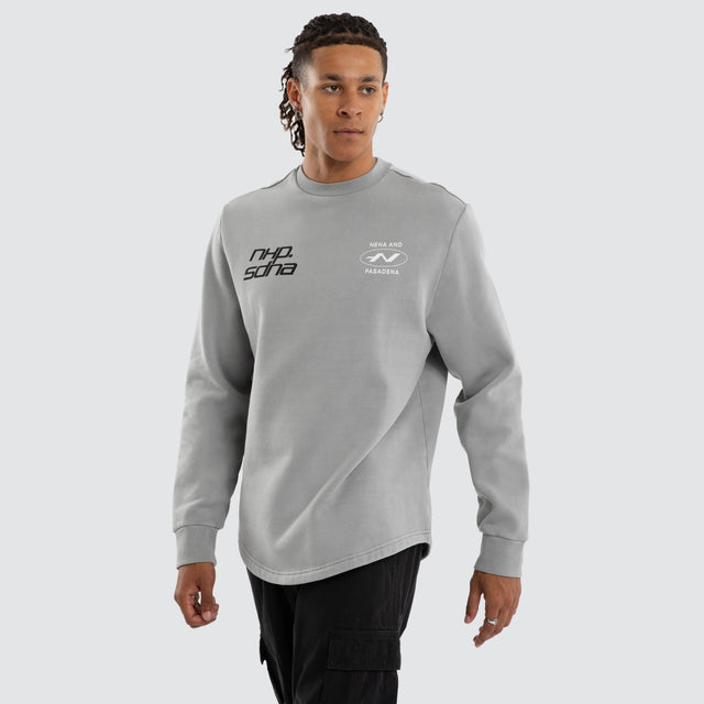 Model wears Independent Curved Sweater Ultimate Grey Jumpers Grey – image 3