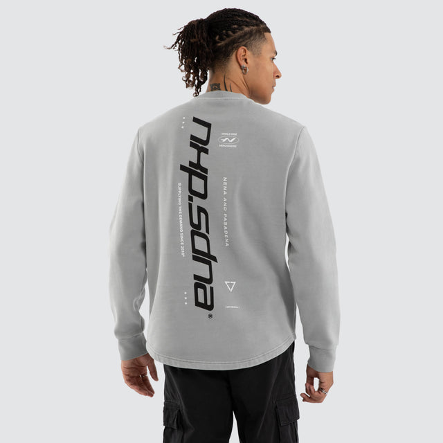 Model wears Independent Curved Sweater Ultimate Grey Jumpers Grey – image 4