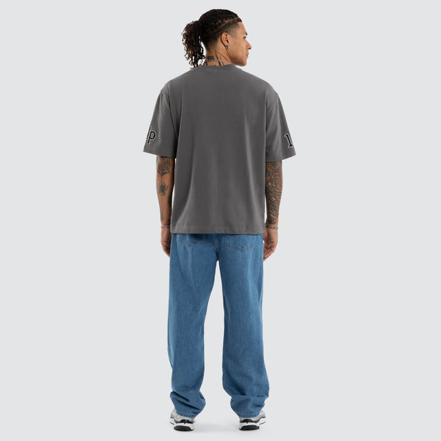 Model wears Warrior Loopback Oversized Tee Charcoal T-Shirts Grey – image 2