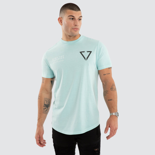 Model wears NXP Eidolon Curved Hem Tee Pigment Blue T-Shirts in Blue - Image 2